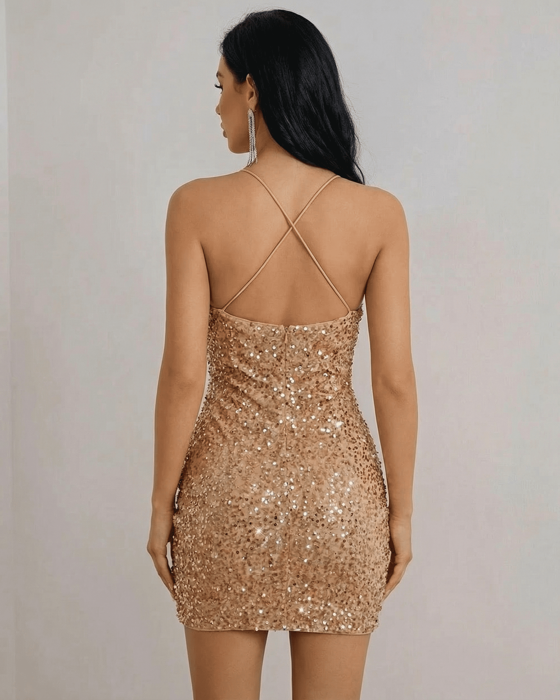 Luna Mini Dress by Lauven, showcasing a gold sequin halter neck design with a flattering fit from the back view.