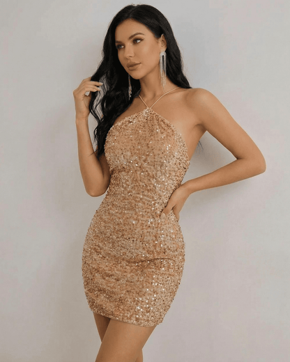 Luna Mini Dress by Lauven in shimmering gold sequin, featuring a halter neck design and structured silhouette.