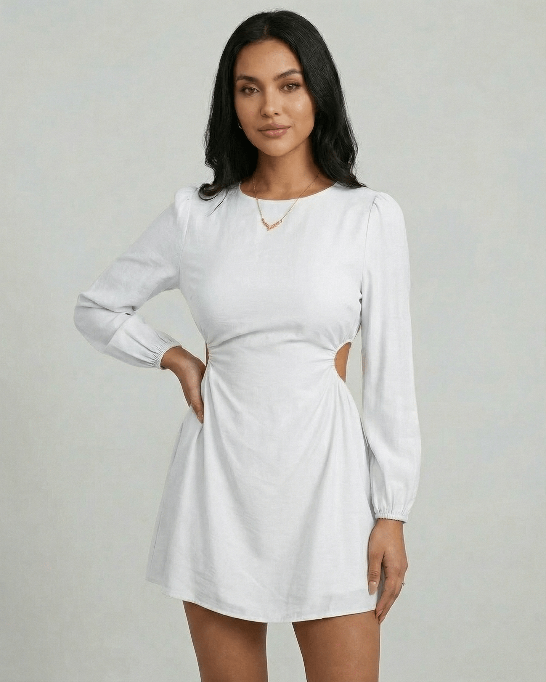Lauven Luna Mini Dress showcasing a long sleeve A-line design with side cut-out detail in bright white.