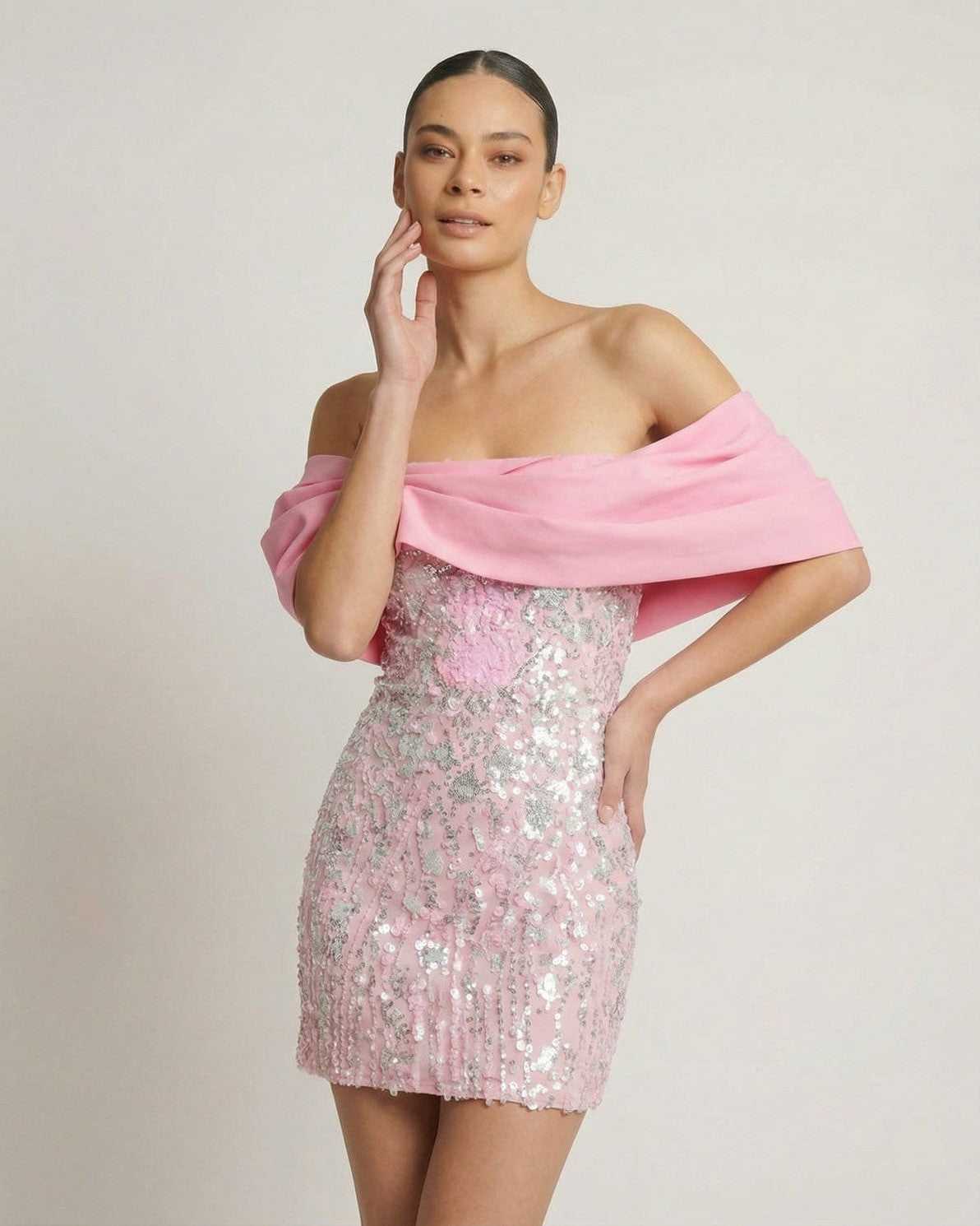 Luna Mini Dress by Lauven, a pink sequin strapless party dress with elegant off-the-shoulder wrap.