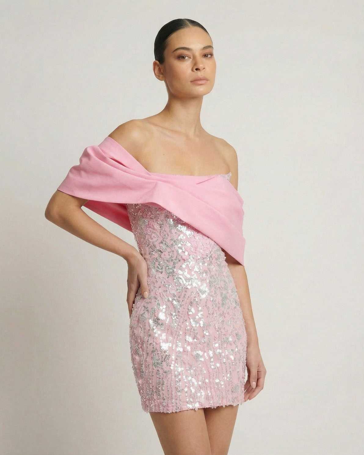 Lauven Luna Mini Dress - Pink sequin strapless party dress with off-the-shoulder draped wrap detail.