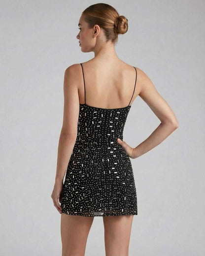Luna Mini Dress by Lauven with rhinestone embellishments showcasing intricate design and fitted silhouette.