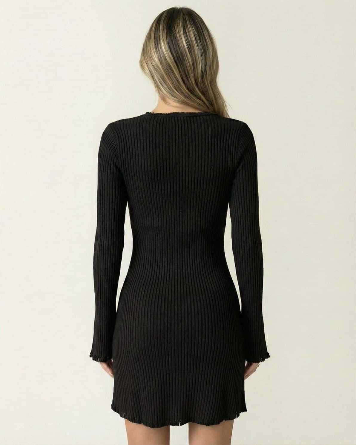 Luna Mini Dress by Lauven, showcasing the back view of a sleek black ribbed bodycon design with long flared sleeves.