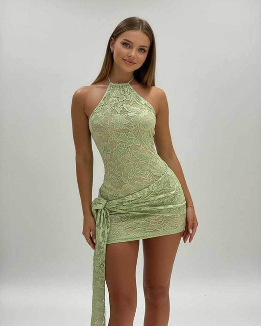 Luna Mini Dress by Lauven in soft green lace, featuring a halter neck and low waist silhouette for elegant evening wear.