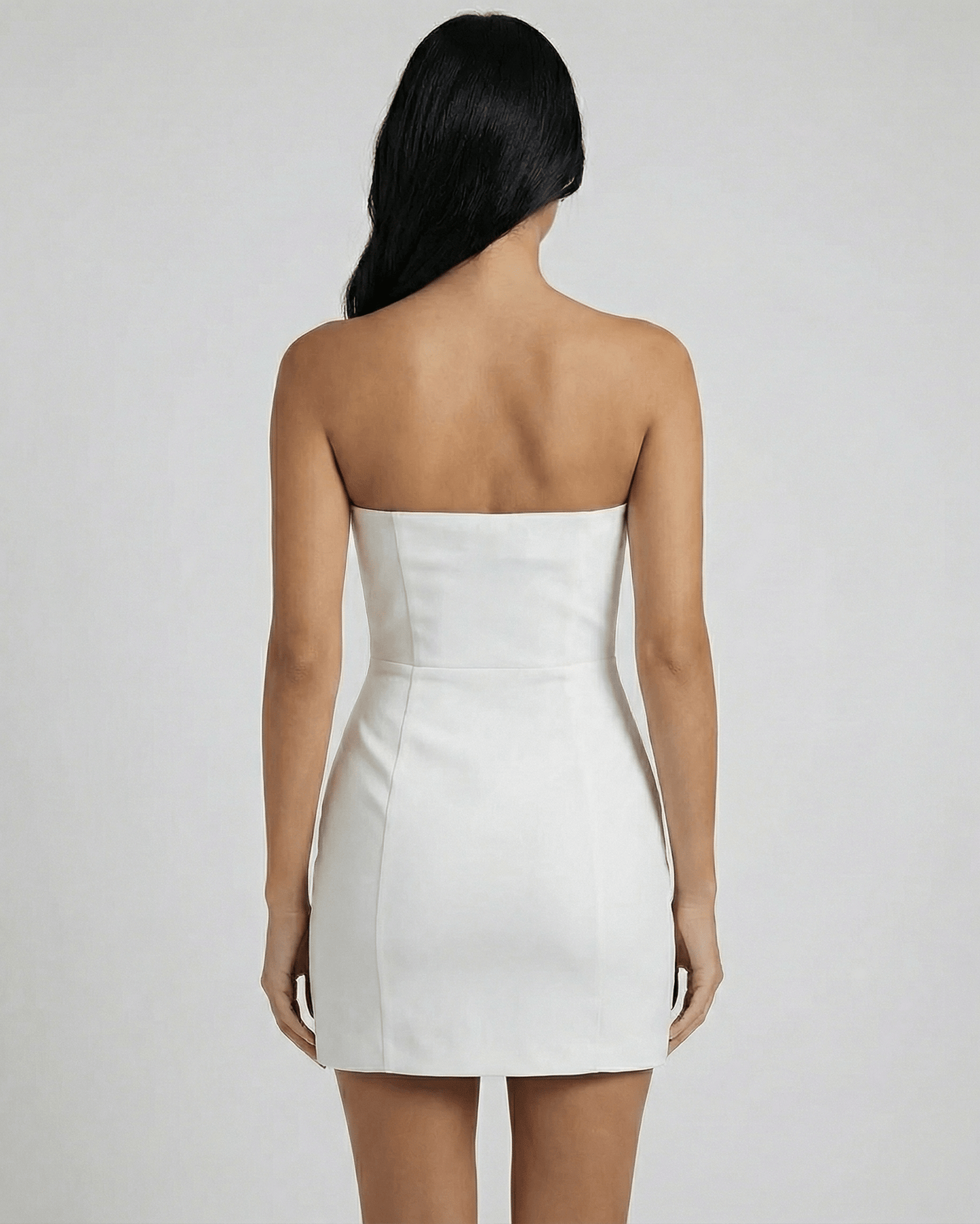 Luna Mini Dress by Lauven, strapless back view showcasing refined cutout detailing and bow accents.