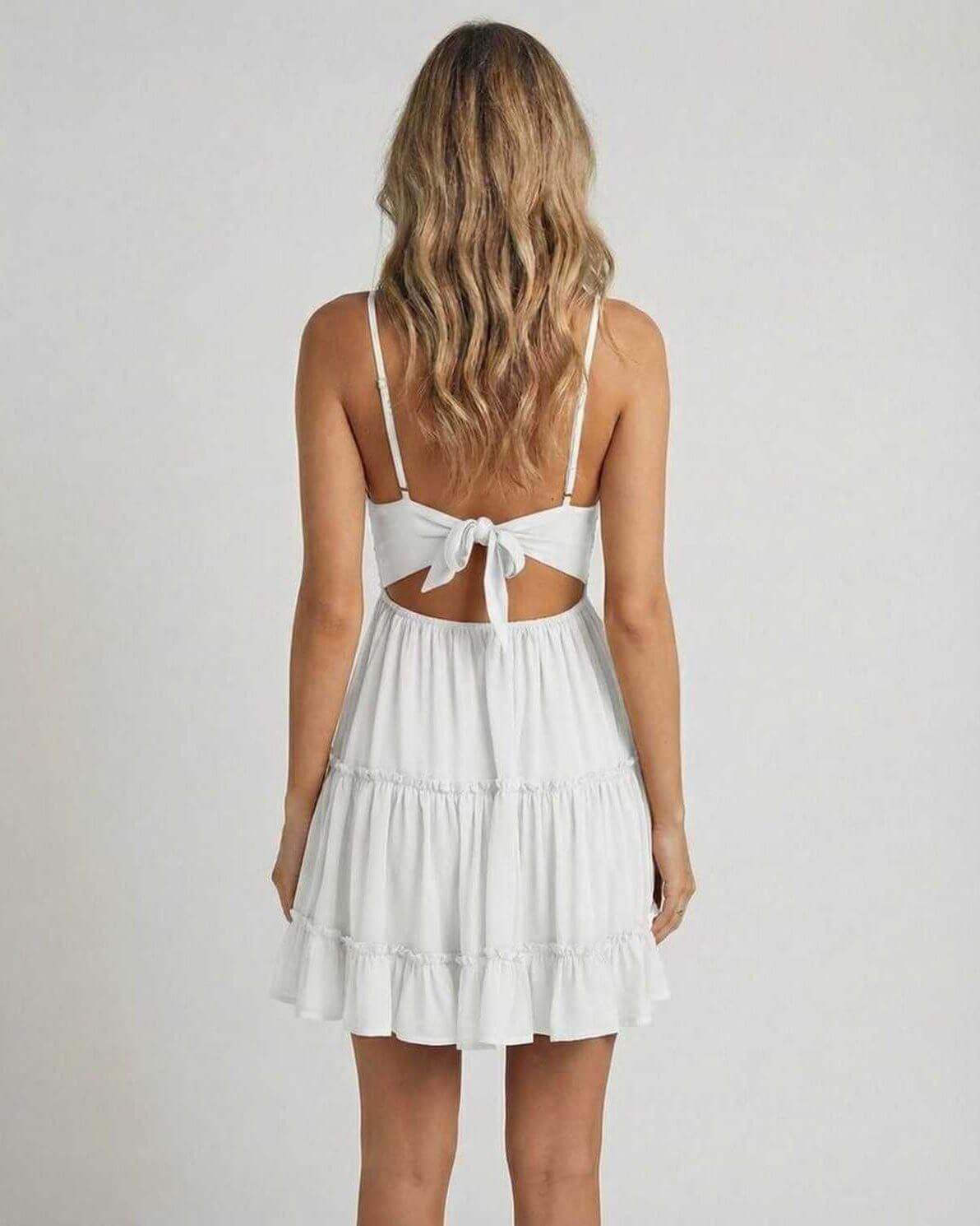 Luna Mini Dress by Lauven, showcasing a back view with an elegant lace bodice and flowy tiered skirt.