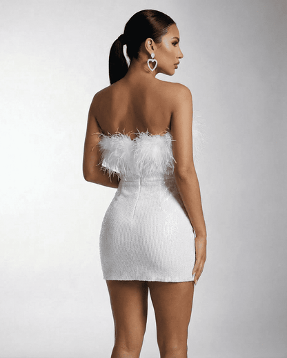 Luna Mini Dress by Lauven, a strapless white dress with sequins and feather fringe detail.