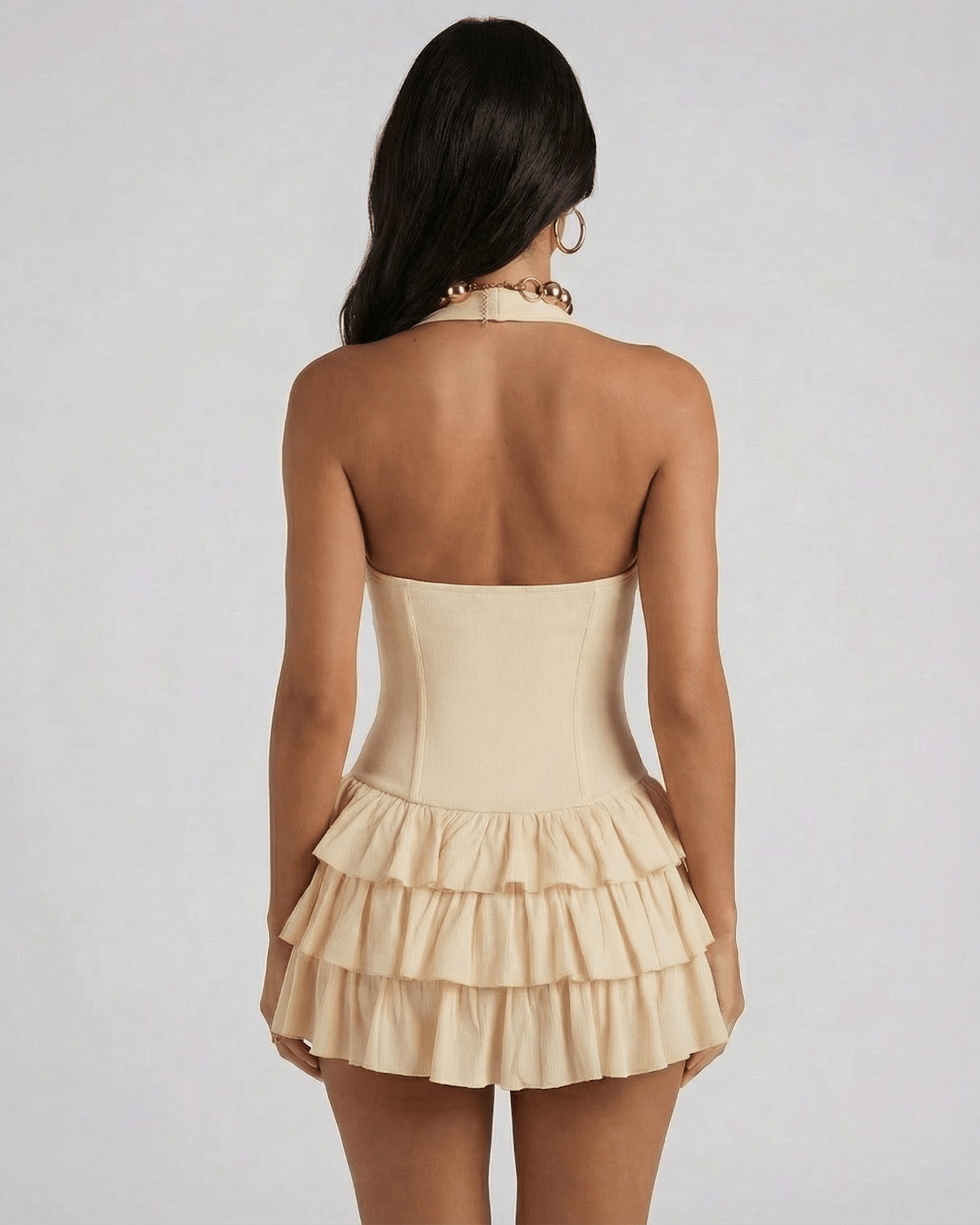 Lunara Mini Dress by Lauven, showcasing a tiered beige design with a square neck and halter cut from the back.