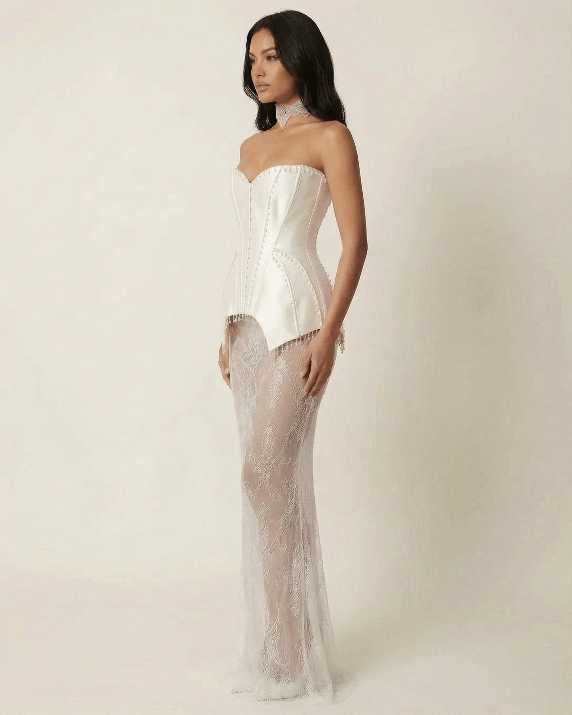 Lunaria Maxi Dress by Lauven features a strapless lace patchwork design with corset-style bodice and sheer skirt.