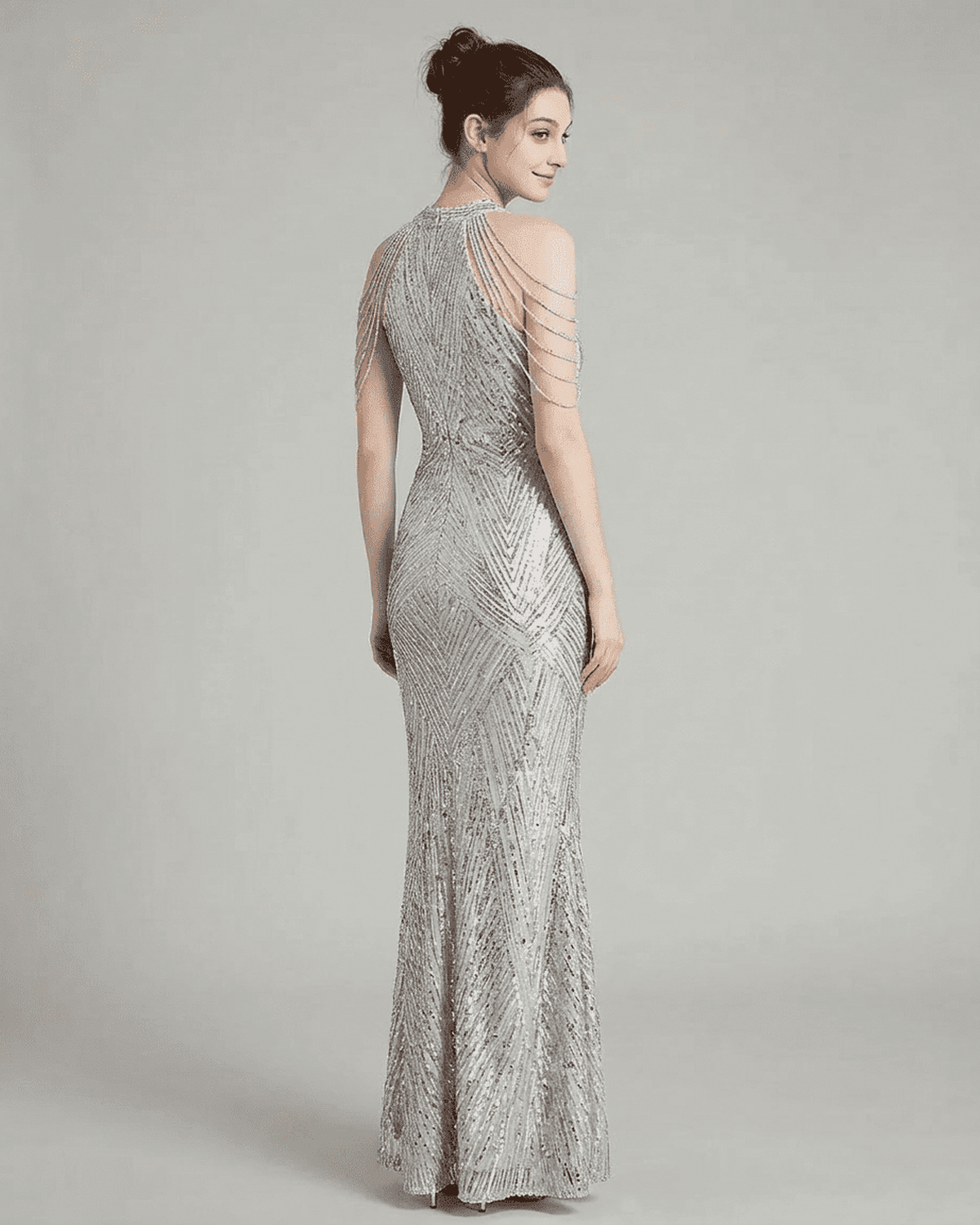 Luxe Maxi Dress by Lauven, showcasing a silver sequin mermaid gown with elegant beaded shoulder drapes.