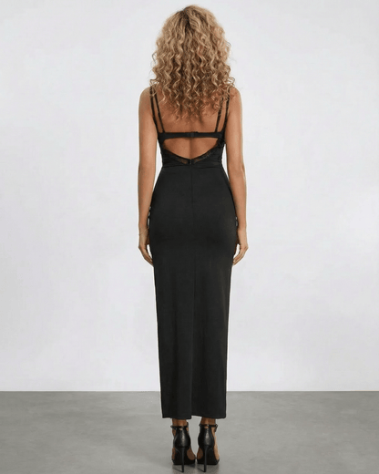 Back view of a woman wearing the Lyra Maxi Dress by Lauven, showcasing its elegant lace panel and sleek silhouette.