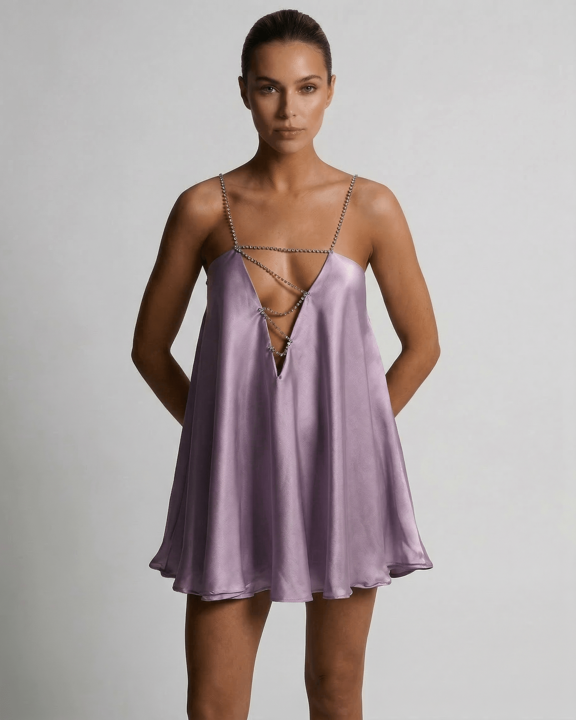 Lyra Mini Dress by Lauven in lilac satin with rhinestone detail, showcasing modern luxury and elegance.