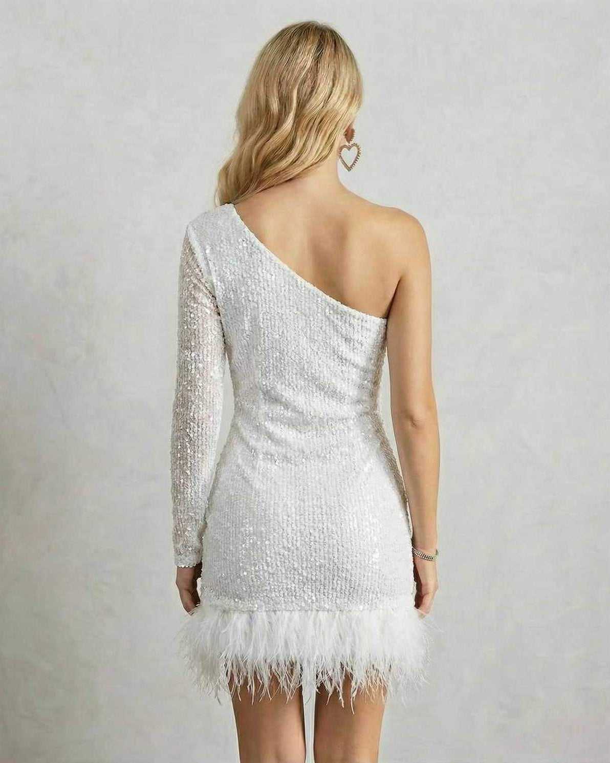 Back view of the Lyra Mini Dress by Lauven featuring a one-shoulder design and feather hem.