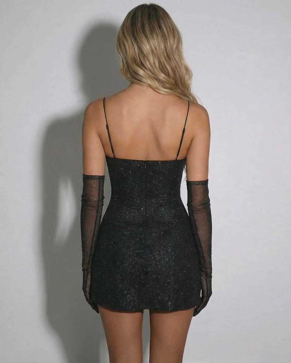 Back view of the Lyra Mini Dress by Lauven, a sequin V-neck bodycon mini with high-waist silhouette.