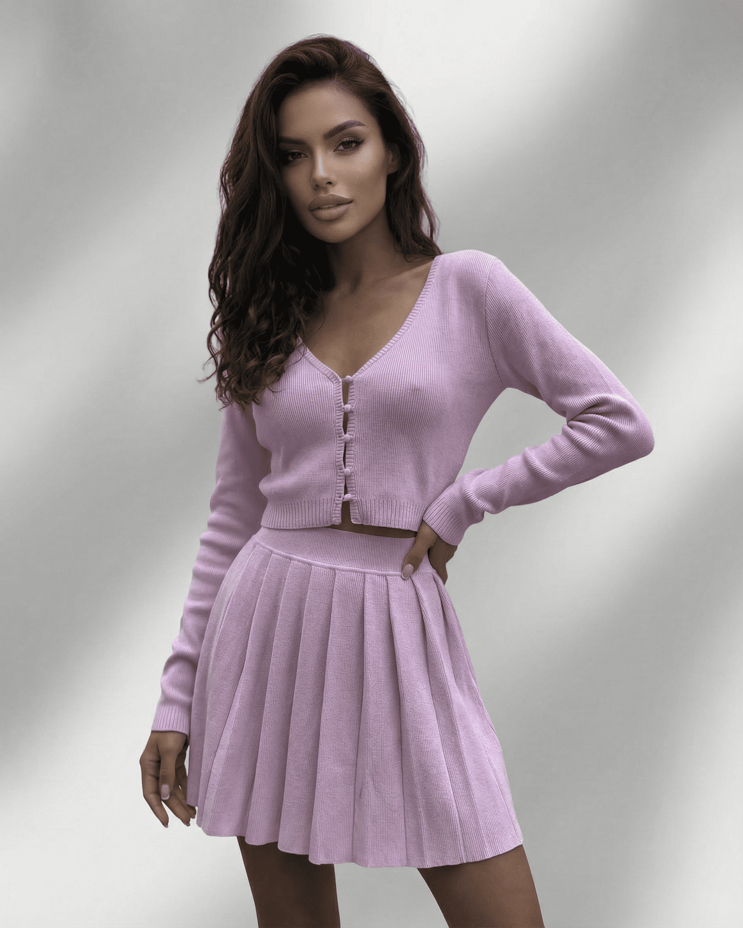 Lyra Two-Piece Set by Lauven featuring a soft knit cardigan and pleated mini skirt in lavender.