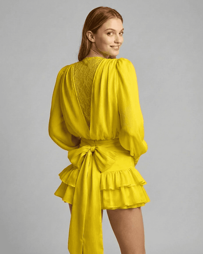 Marigold Mini Dress by Lauven, showcasing lace detail and a tiered silhouette in bright yellow fabric.