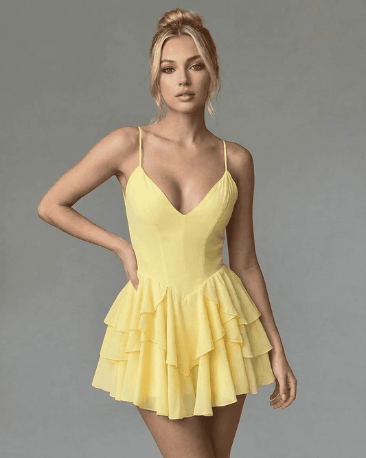 Lauven Marigold Mini Dress showcasing a V-neck, spaghetti straps, and a tiered ruffle skirt in vibrant yellow.