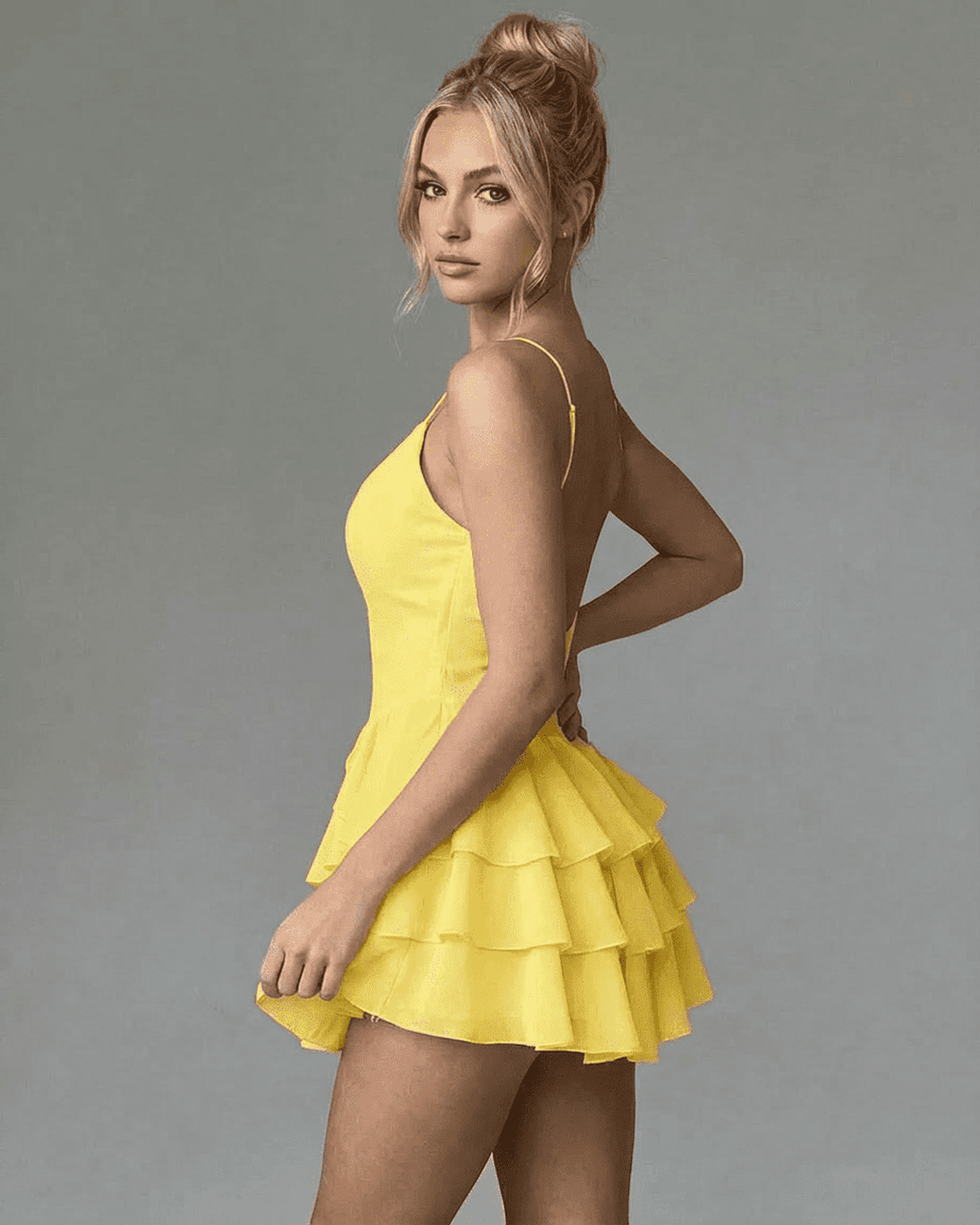Marigold Mini Dress by Lauven, featuring a stylish tiered ruffle design and adjustable spaghetti straps.