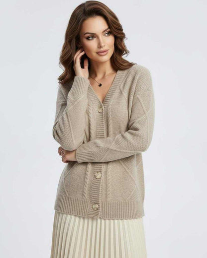 Model wearing Marin Cardigan by Lauven, a cozy beige knitwear with a button-down front and V-neckline.