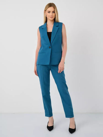 Marine Suit Set by Lauven, sleeveless teal vest and high-waist trousers for a chic look.