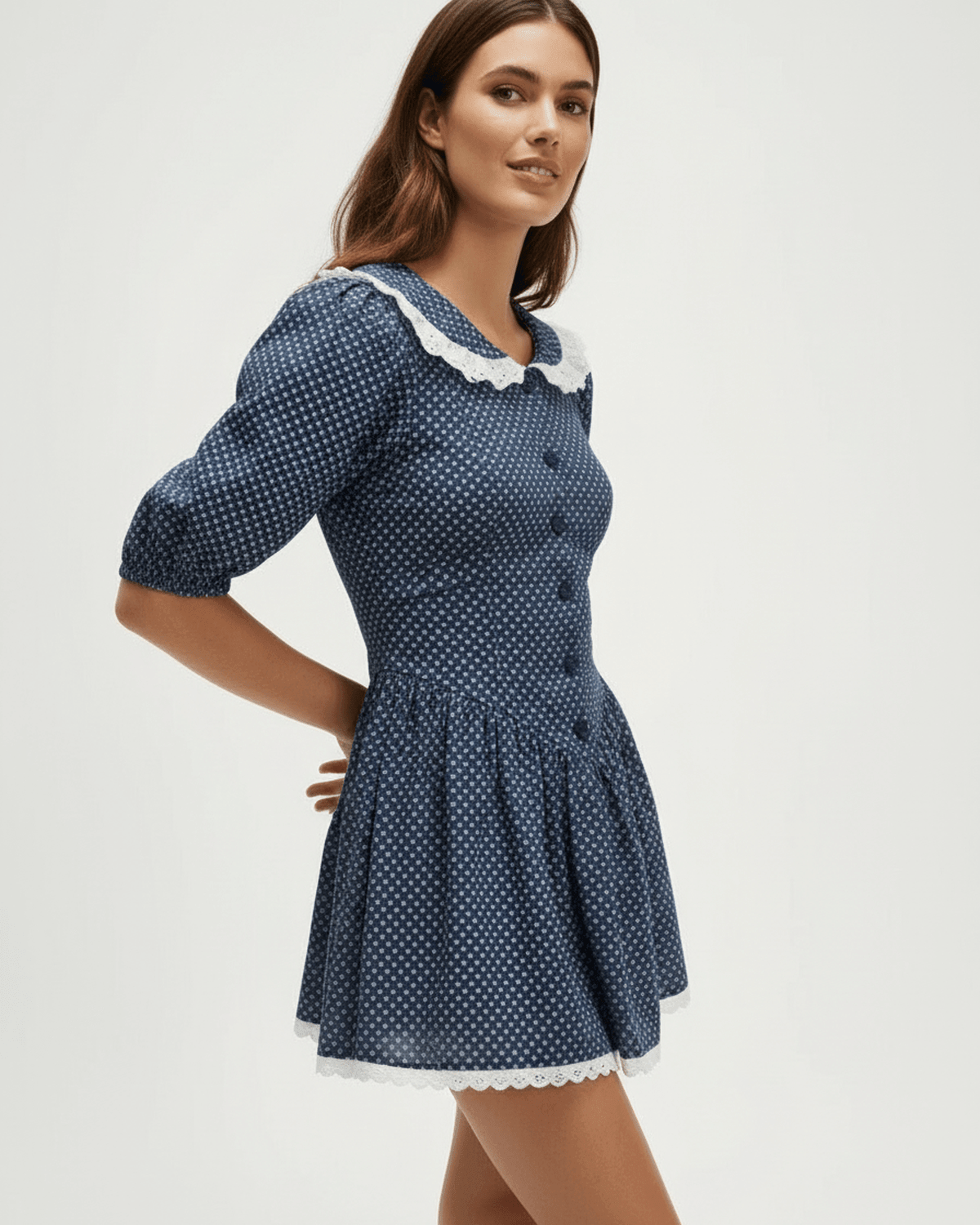 Marinette Mini Dress by Lauven featuring Peter Pan collar and puff sleeves in navy polka dot design.