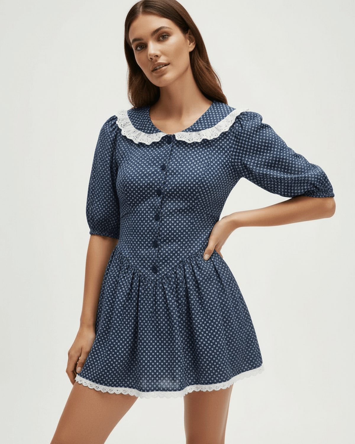 Lauven Marinette Mini Dress with Peter Pan Collar and Puff Sleeves in navy blue with polka dots.