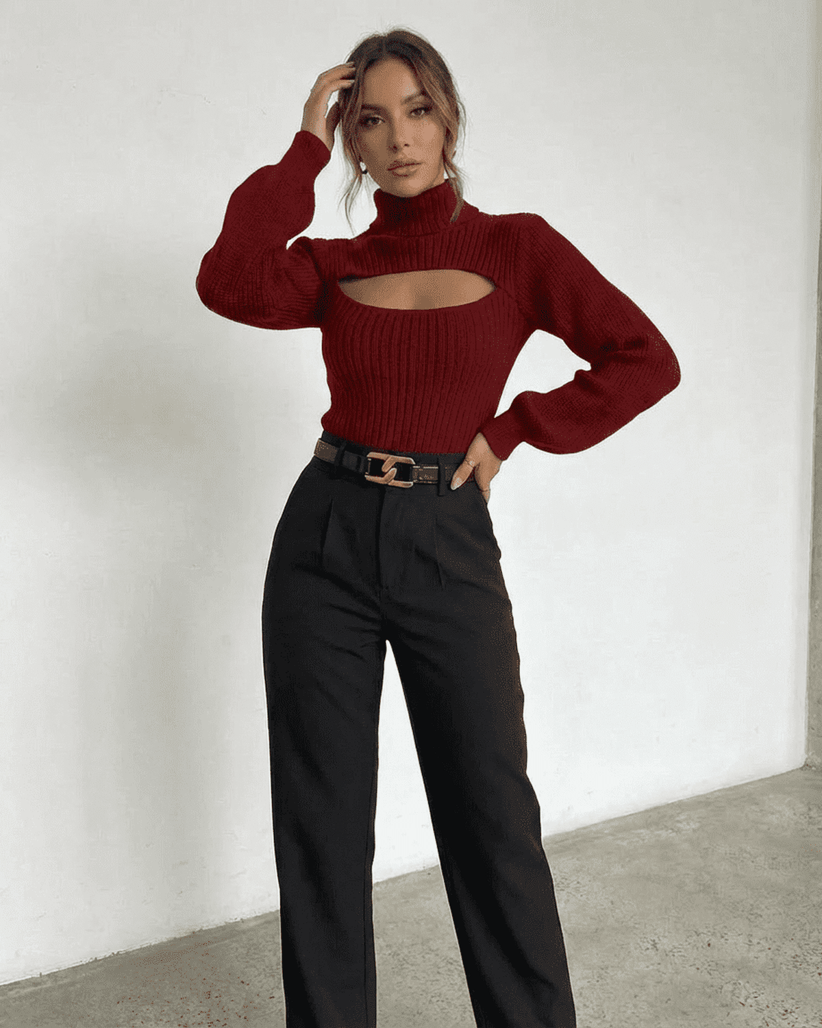 Model wearing the Merlot Sweater by Lauven, showcasing the mock neck and cut-out design.