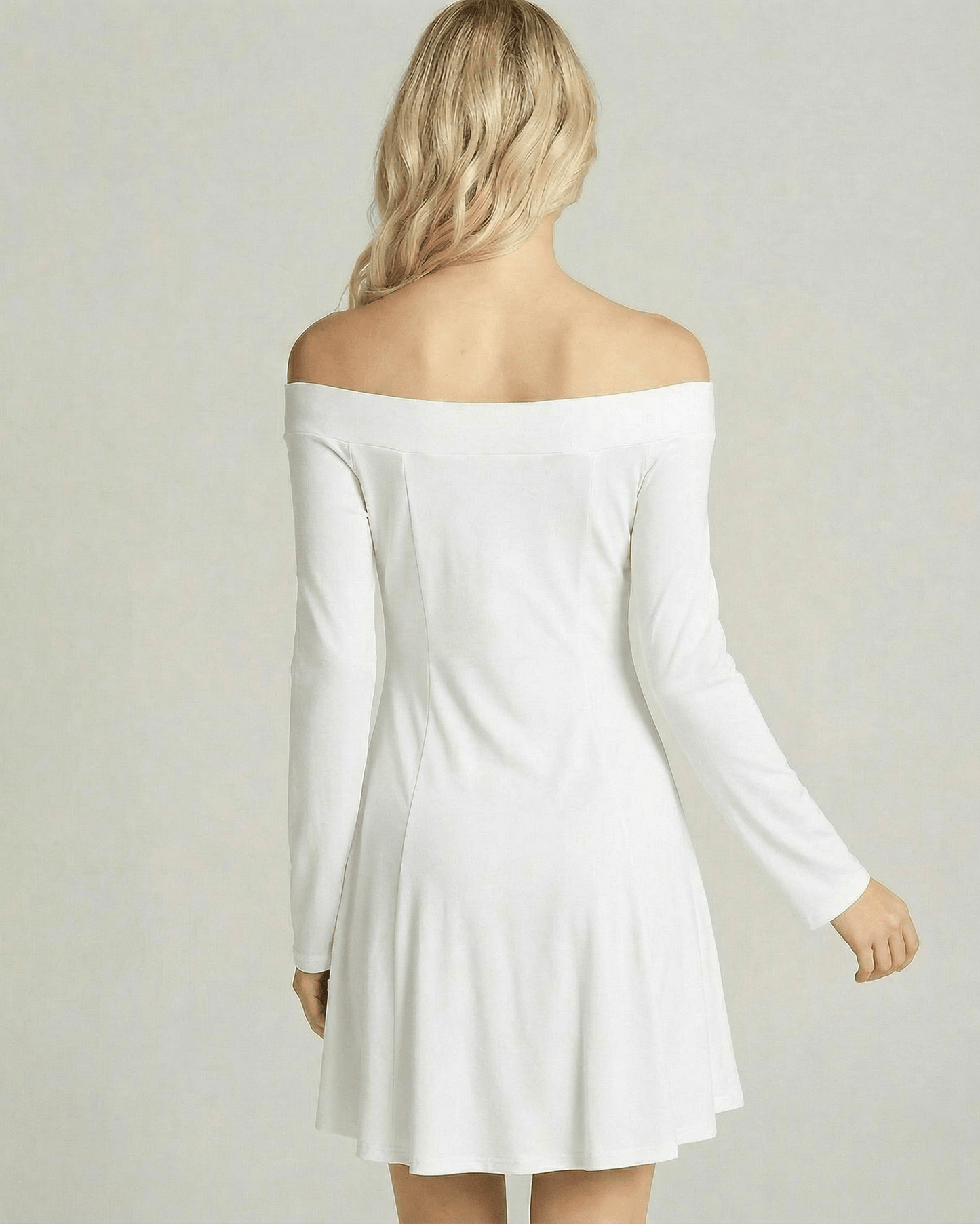 Image of the back view of the Milano Mini Dress by Lauven, featuring an off-shoulder design and A-line silhouette.