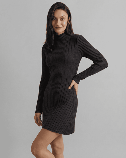 Model showcasing the Milano Mini Dress by Lauven, featuring a ribbed knit, mock neck, and long sleeves.