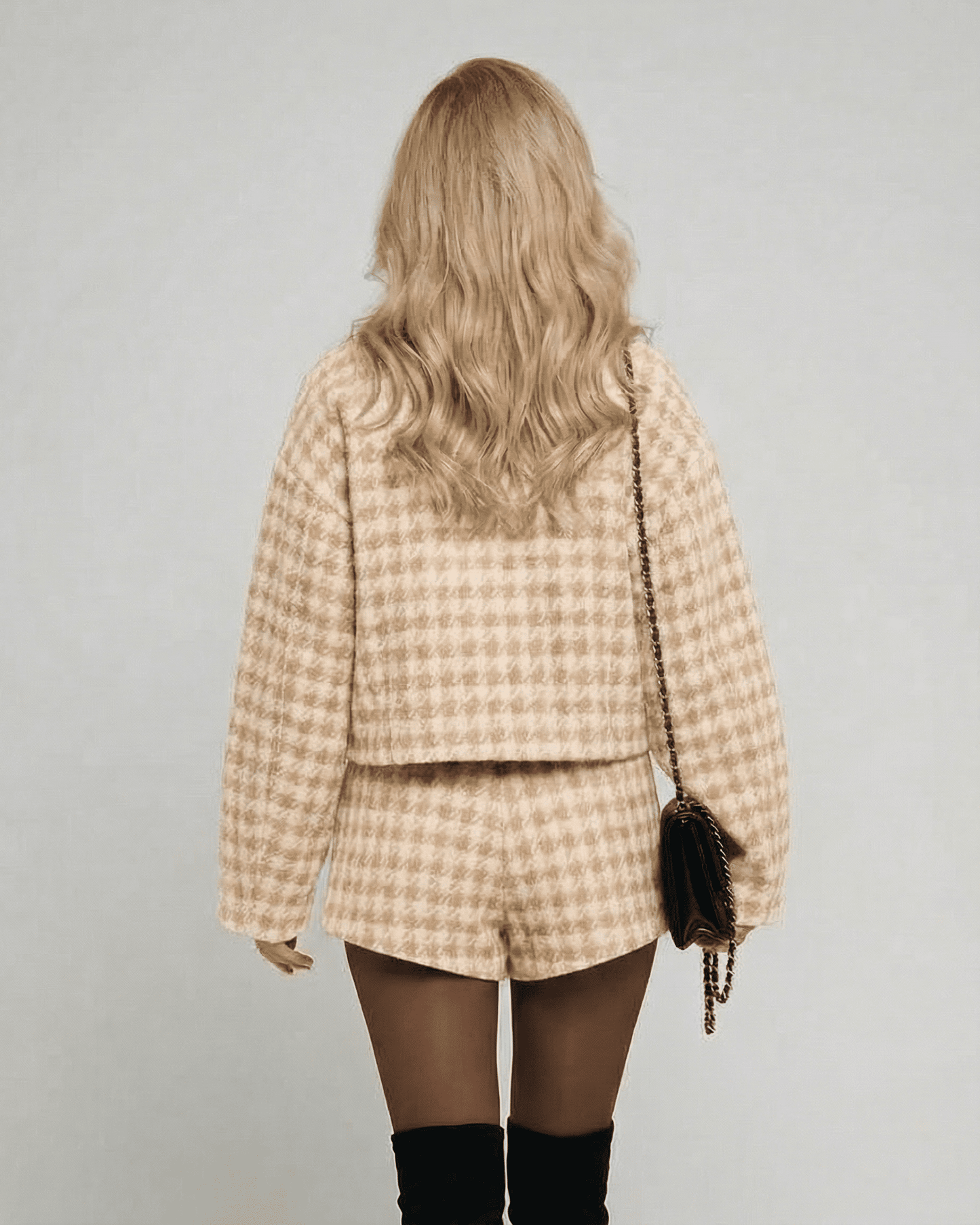 Back view of a model wearing the Lauven Milano Set, an elegant chic two-piece set with tailored shorts.