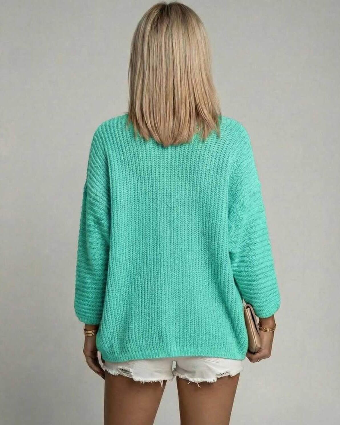 Women wearing the Mint Aura Cardigan by Lauven, showcasing the back view in mint green knit.