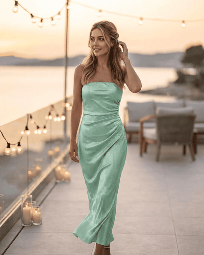 Model wearing the Minté Maxi Dress by Lauven, featuring a strapless tube silhouette and subtle ruched texture.