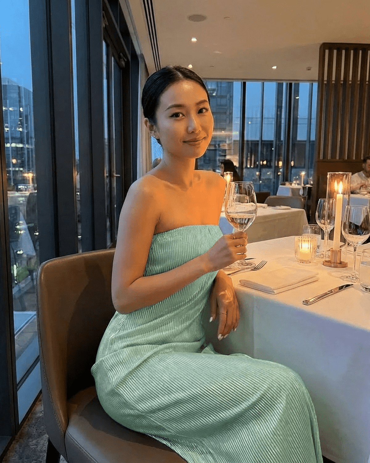 Model wearing the Minté Maxi Dress by Lauven, featuring a strapless tube silhouette and subtle ruched texture.