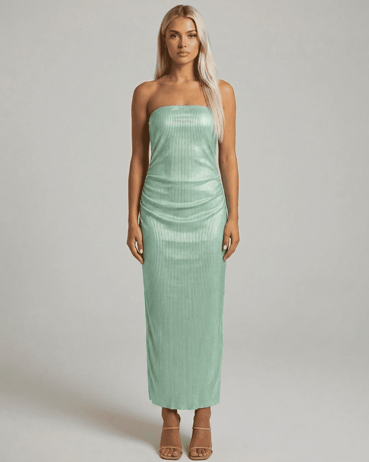 Model showcasing the Minté Maxi Dress by Lauven, featuring a strapless tube silhouette and subtle ruched texture.