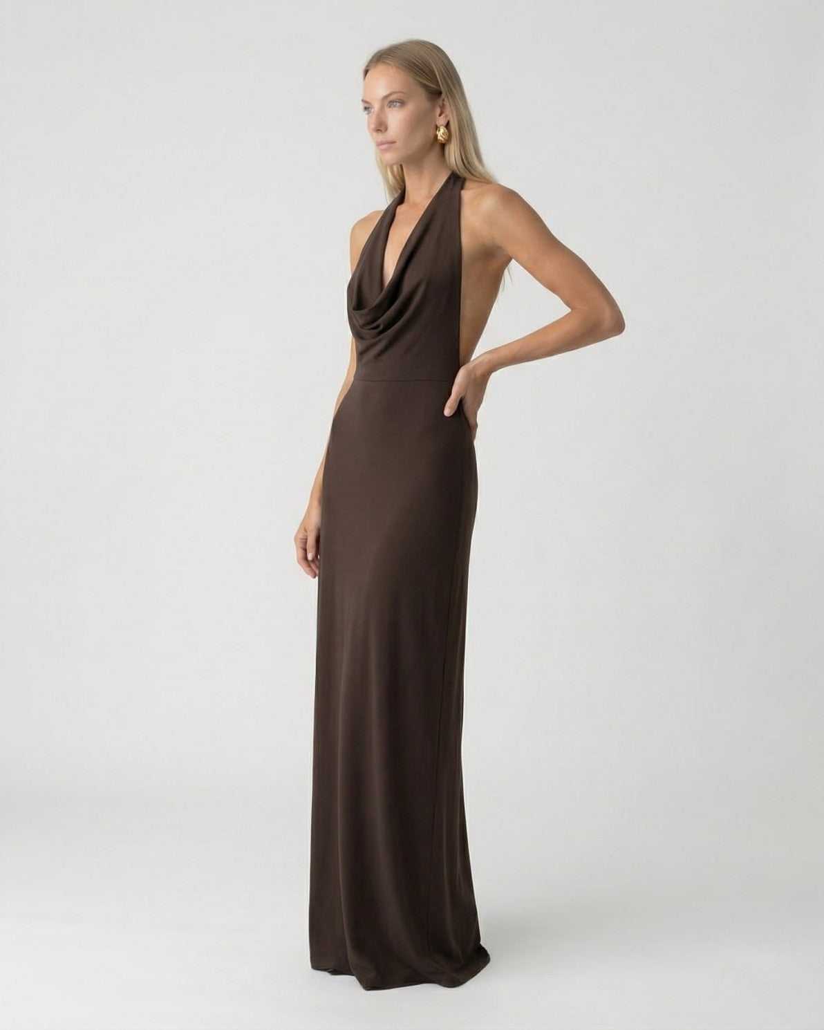 Model showcasing the Lauven Mocha Maxi Dress, a halter neck slip dress with an elegant open back design.