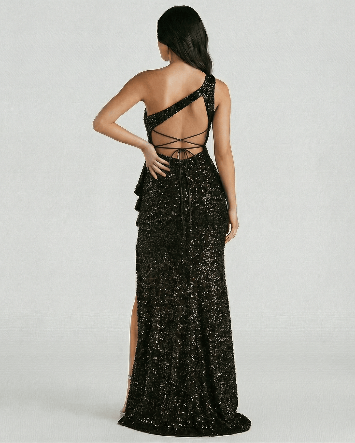Monaco Maxi Dress by Lauven featuring a stunning black sequin design with a one-shoulder and high slit, showcasing the back view.