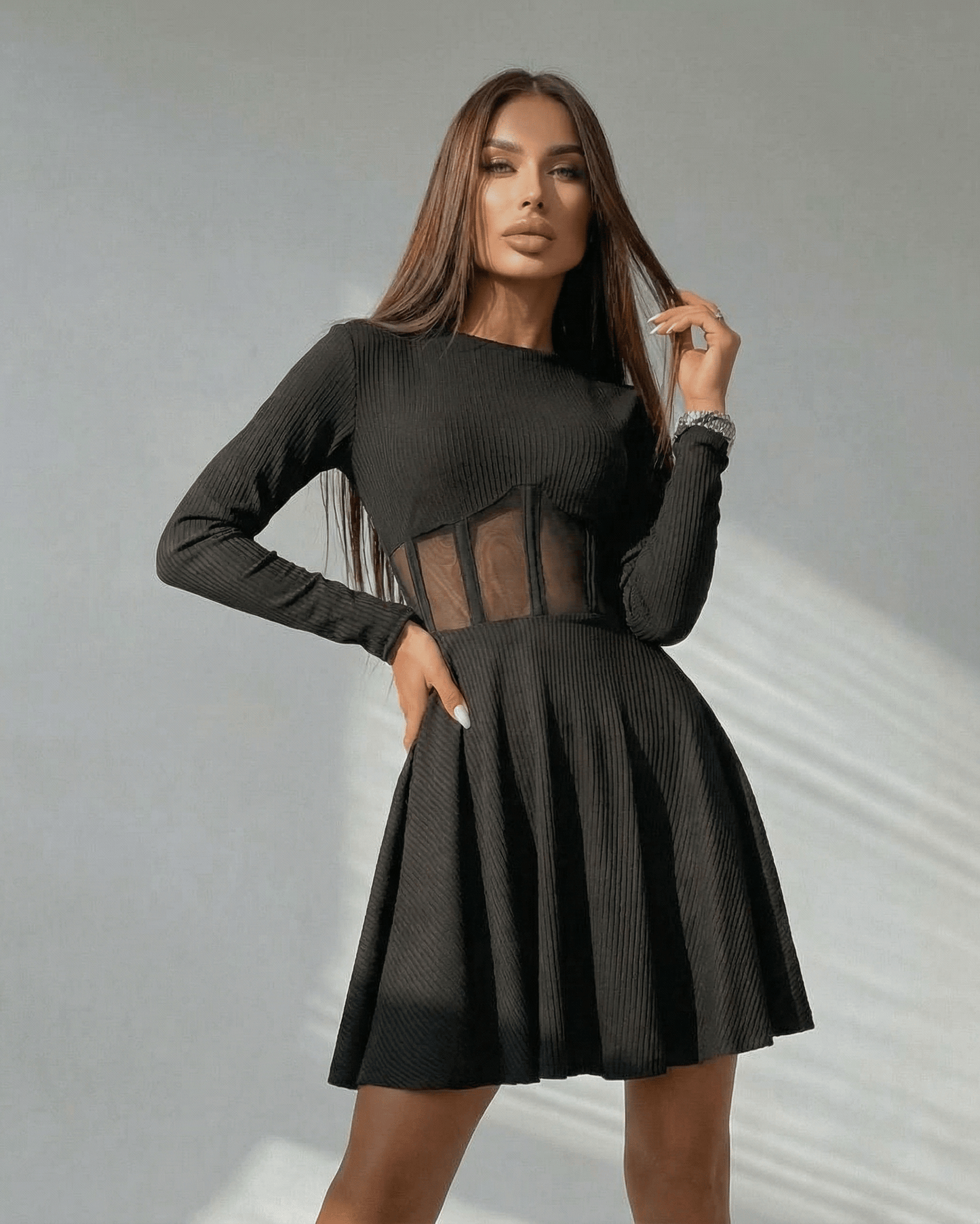 Lauven Monaco Mini Dress showcasing a black long sleeve A-line silhouette with sheer corset panel detail.