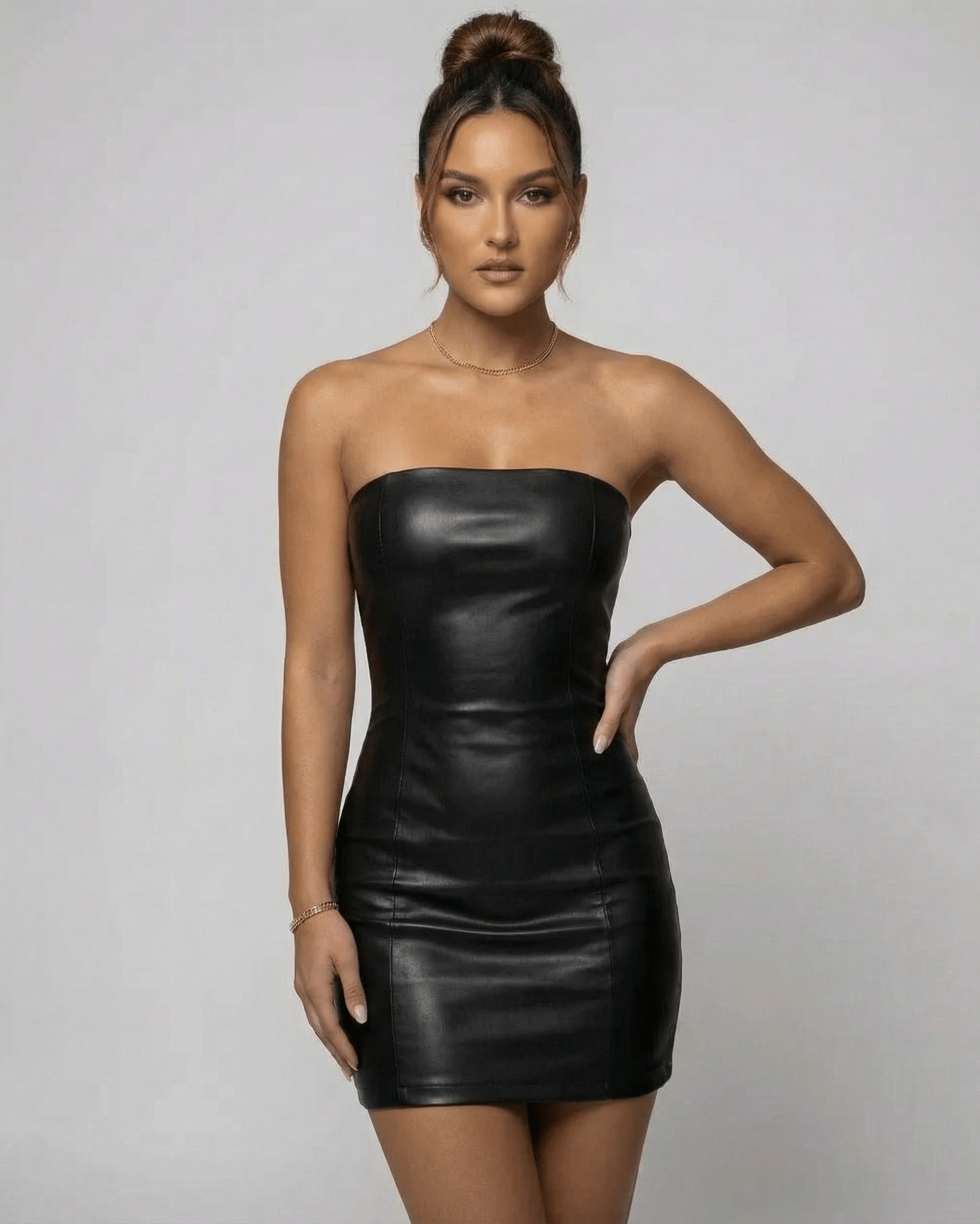 Monaco Mini Dress by Lauven, a sleek black strapless PU pencil dress, perfect for modern warm-weather styling.