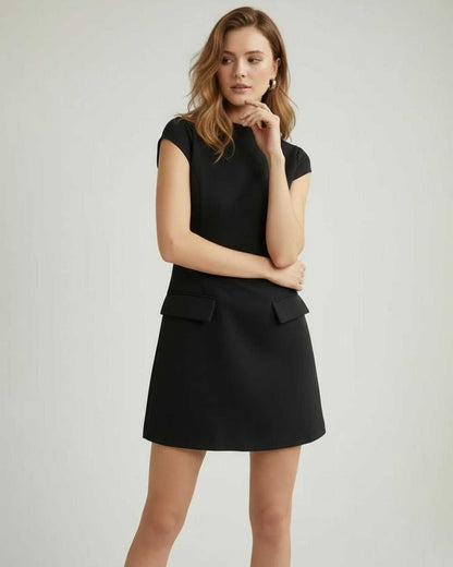 Monaco Mini Dress by Lauven, women’s black A-line mini dress with structured silhouette and pocket detail.