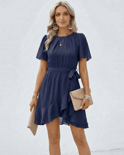 Elegant Navy Ruffle Dress by Lauven with waist tie and flutter sleeves, perfect for sophisticated occasions.