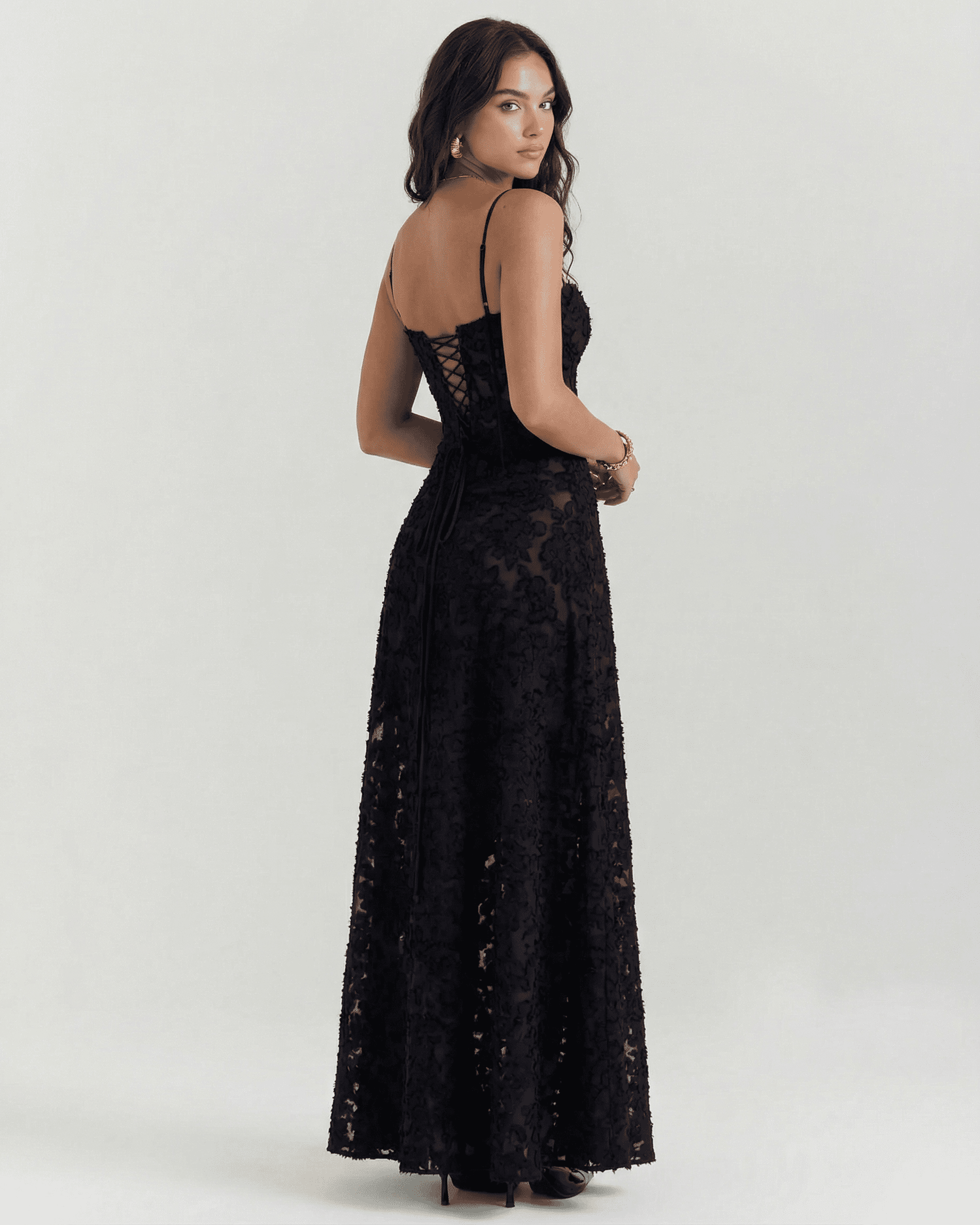 Nerina Maxi Dress by Lauven, showcasing a stunning black floral lace design with an elegant back detail.