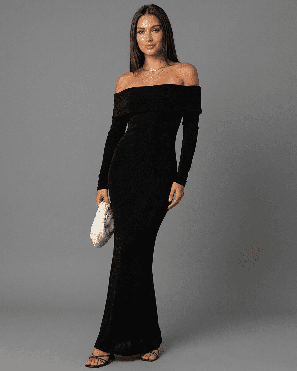Model showcasing the Noctura Maxi Dress by Lauven, an elegant off-shoulder bodycon maxi dress with long sleeves.