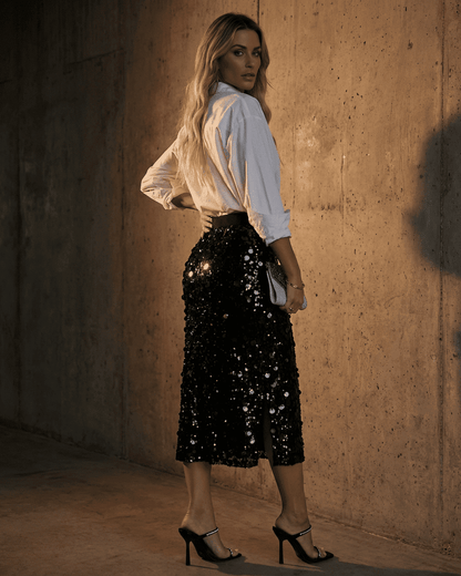 Model wearing Noctura Midi Skirt by Lauven, showcasing a high waist bodycon design with sequins.