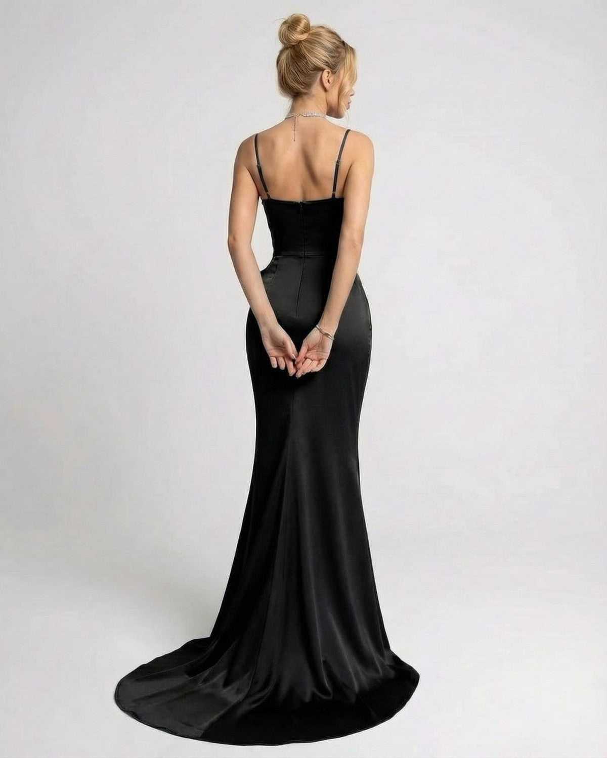 Back view of a model wearing the Lauven Nocturne Maxi Dress, featuring a sleek design and elegant train.