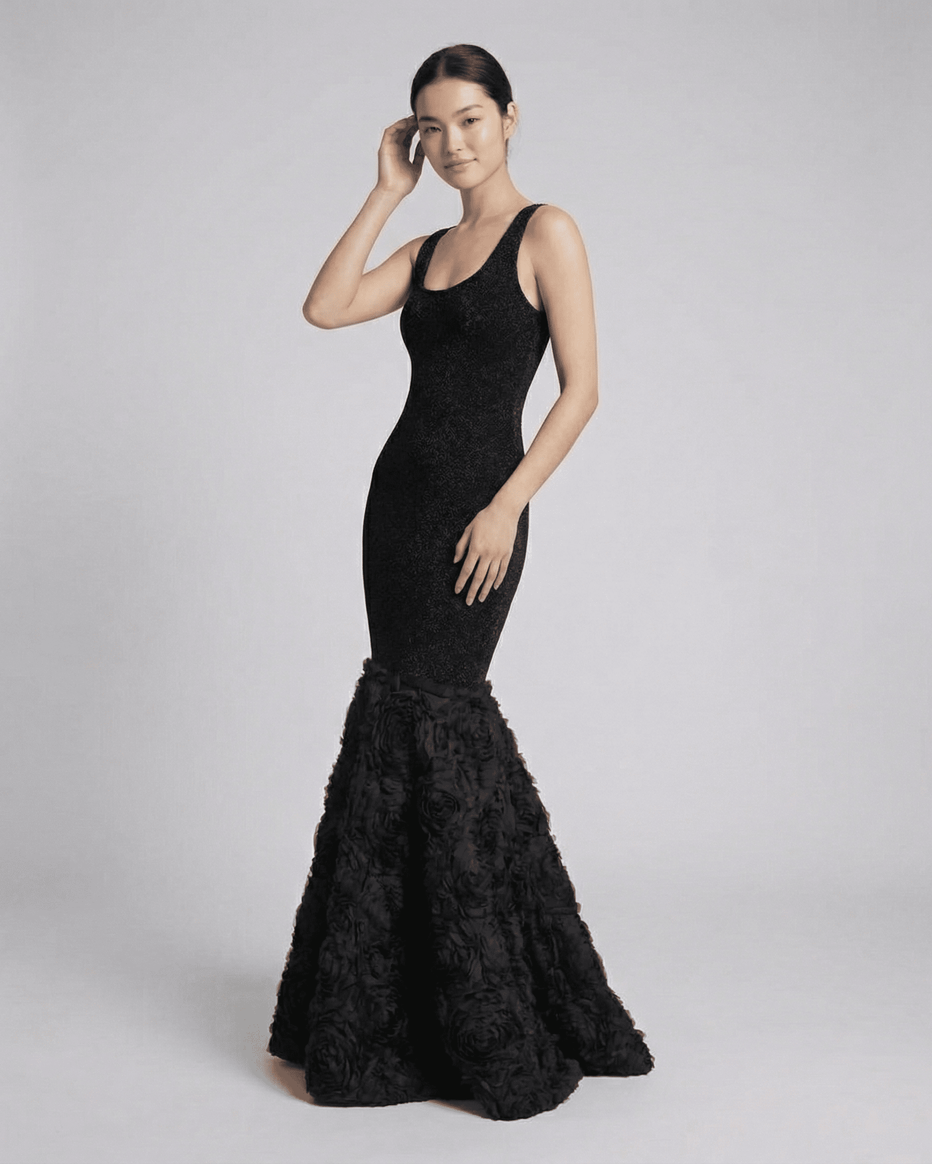 Nocturne Maxi Dress by Lauven featuring a sculpted silhouette and textured hem, showcasing an elegant black evening look.