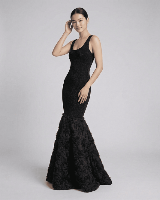 Nocturne Maxi Dress by Lauven featuring a sculpted silhouette and textured hem, showcasing an elegant black evening look.