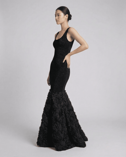 Nocturne Maxi Dress by Lauven, showcasing a sculpted silhouette with a textured hem detail in elegant black.