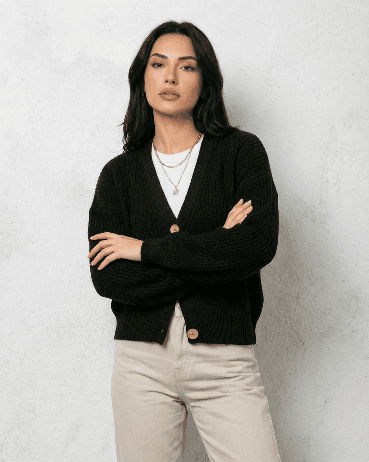 Noir Cardigan by Lauven, a sleek black knitwear with v-neck and button detail, perfect for cozy outfits.