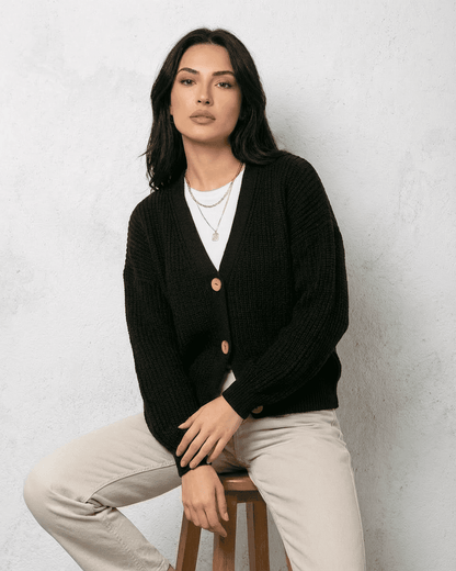 Noir Cardigan by Lauven, a sleek black knitwear piece with classic V-neck and button detail.