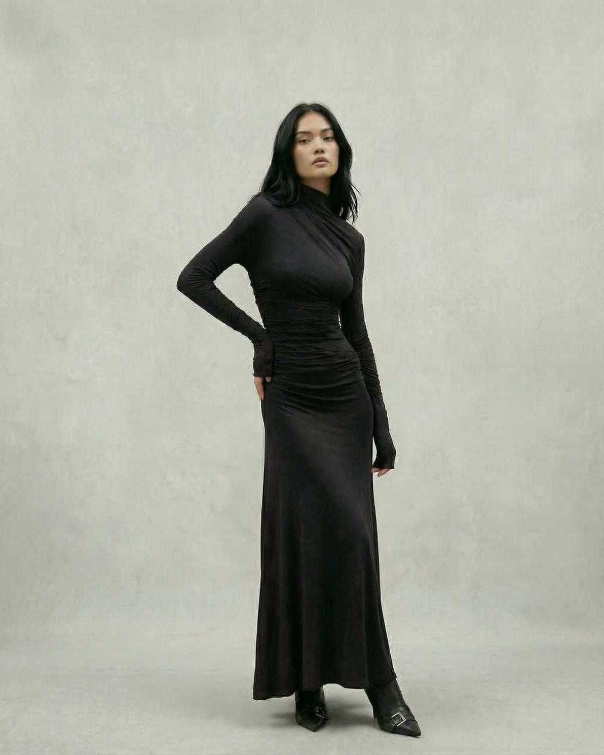 Noir Maxi Dress by Lauven, featuring a sleek black sheath silhouette with a half-high collar and long sleeves.